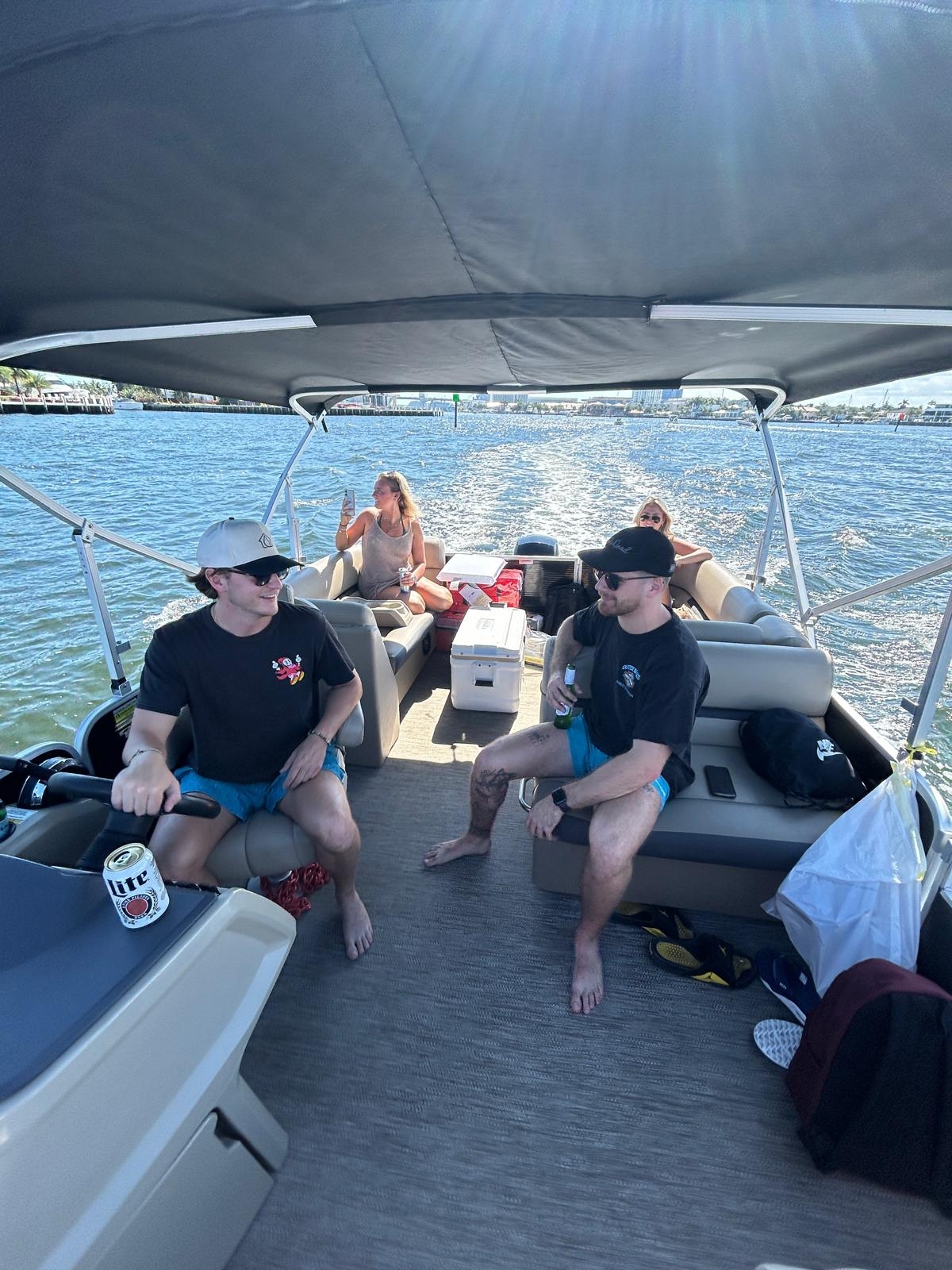 A stocked cooler with and drinks inside on a luxury pontoon charter in Fort Lauderdale